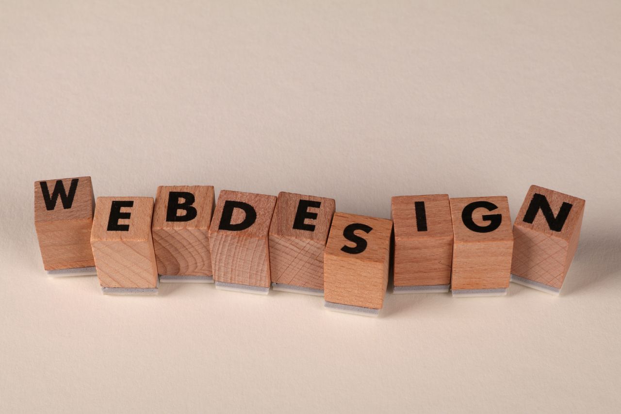 about-02 Wooden blocks spelling web design creatively showcase digital design concept.